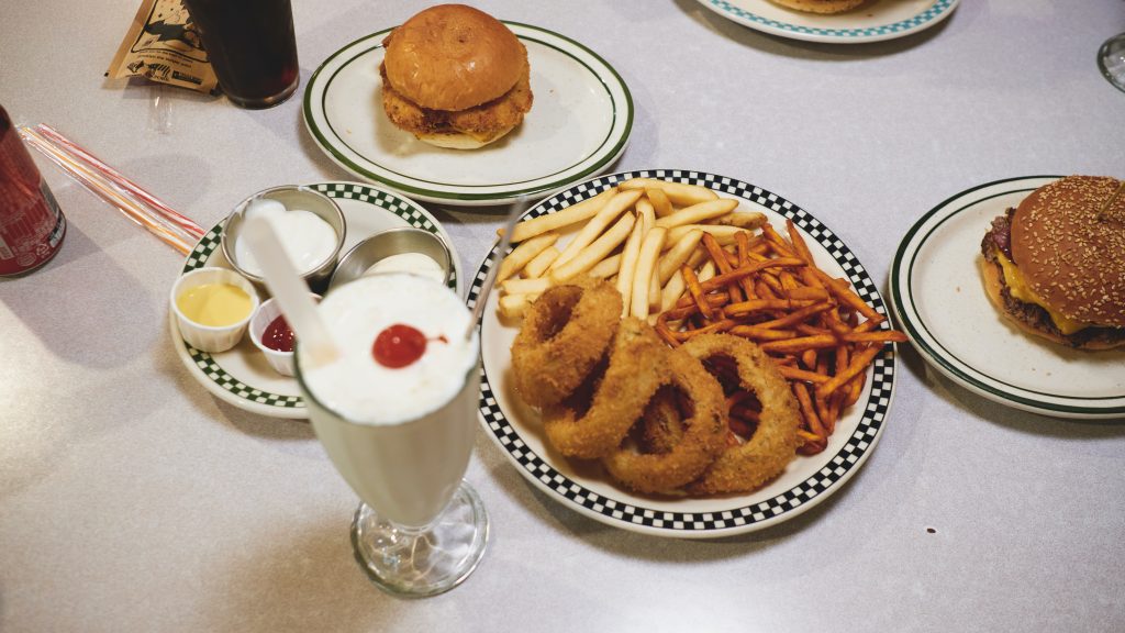 A feast of unhealthy fried foods and a milkshake