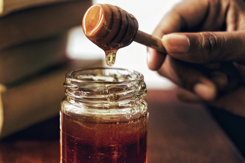 Jar of honey and a honeycomb